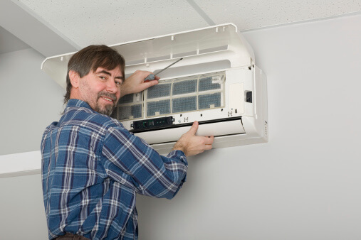 John Betlem Heating and Cooling, Inc. technician working on a ductless unit. 