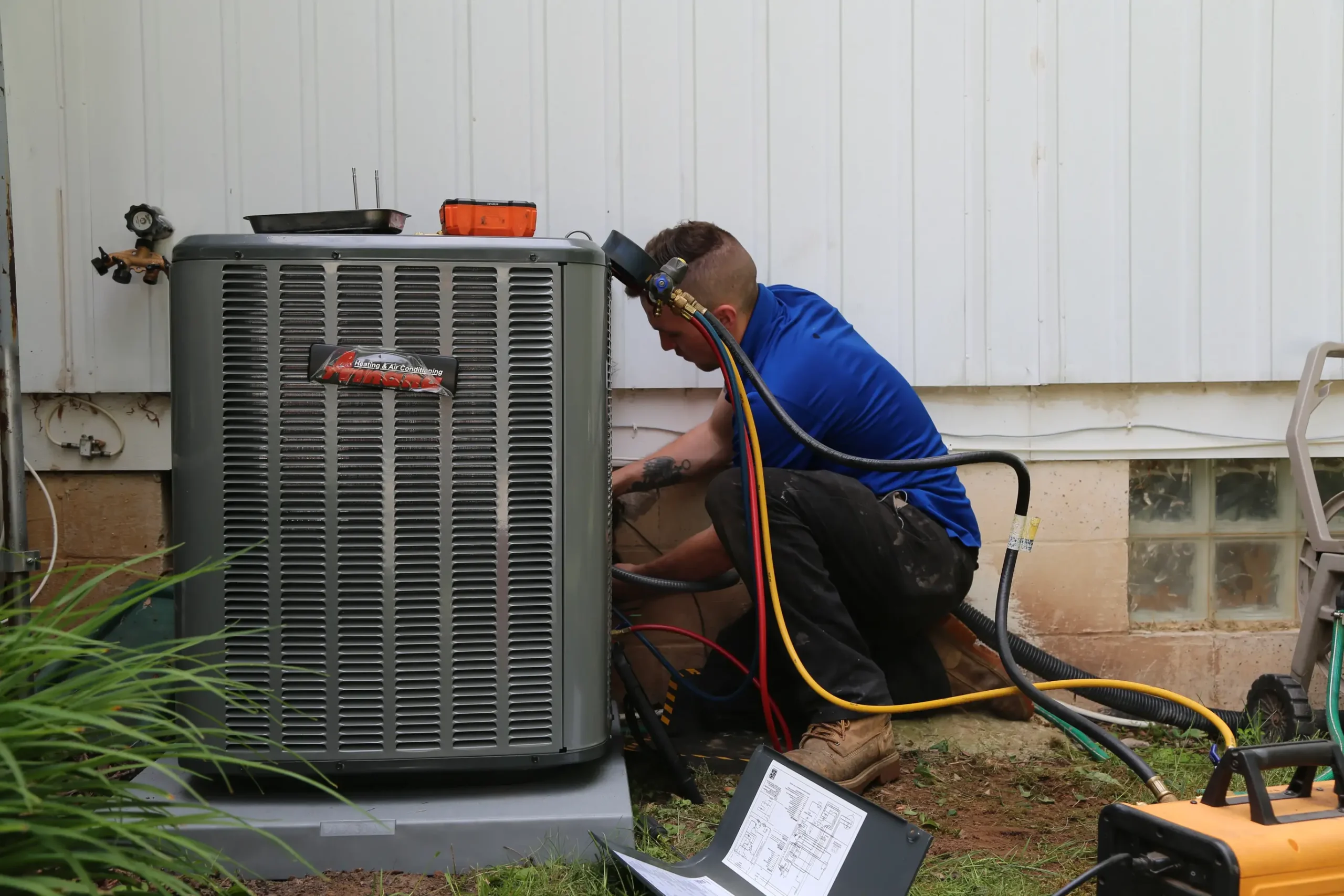 Technician servicing HVAC system