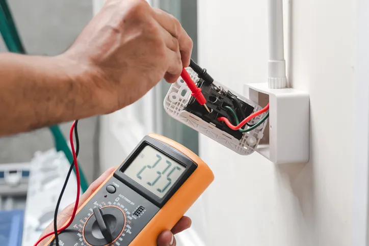 Electrician checking wires