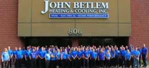 John Betlem team photo in front of storefront